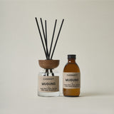 Casimot Mugung diffuser and bottle on a beige background